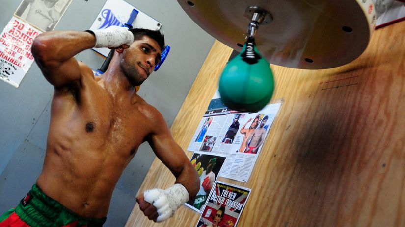 Hung up his gloves: Former world champion Amir Khan retires from boxing