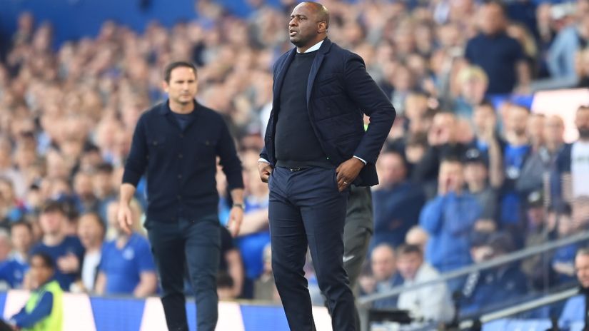 You ain't messing with a petrified fella: Vieira kicks an Everton fan during a celebratory pitch invasion